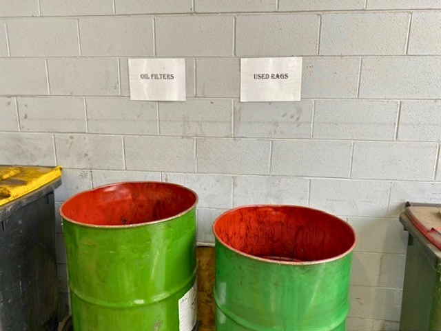 oil barrels in an automotive factory